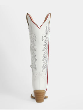 A single white western cowboy boot shown from the back, featuring silver embroidered floral patterns, a red side stripe, and a brown stacked heel on a light gray background.