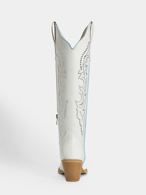 A single white western cowboy boot shown from the back, featuring silver rhinestone embroidery, a light blue edge trim, and a tan stacked heel, set against a plain light gray background.